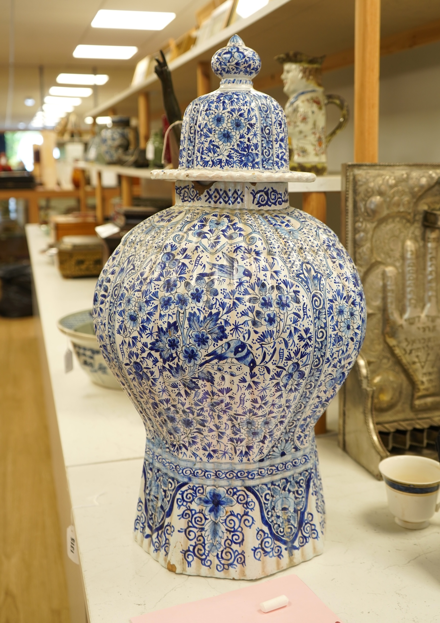 A large Delft blue and white vase and cover, 65cm tall